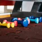 Rubber gym flooring in a fitness center showing a clean and well-maintained surface