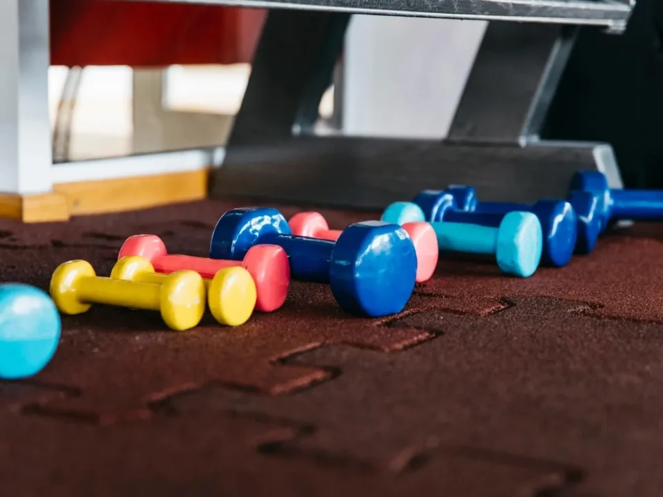 Rubber gym flooring in a fitness center showing a clean and well-maintained surface