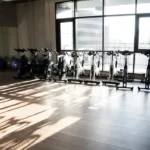 Gym floor resurfacing and refinishing showing differences in surface repair and restoration depth