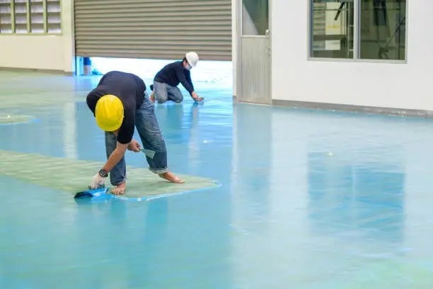 Textured epoxy flooring in a commercial workspace