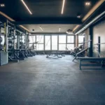 Indoor sports facilities with rubber gym flooring designed to reduce impact and improve athlete safety during games and training.