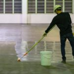 Durable epoxy-coated floor in a busy Denver warehouse with forklifts and heavy equipment