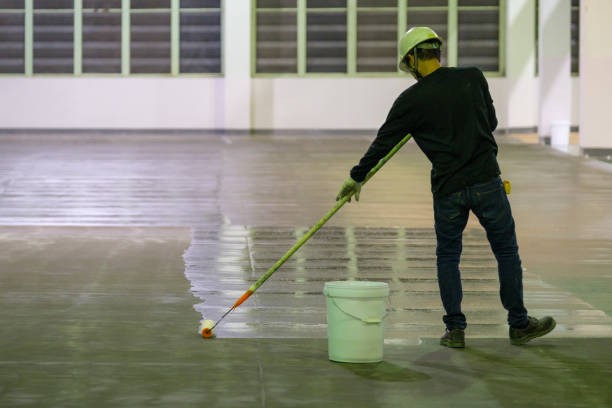 Durable epoxy-coated floor in a busy Denver warehouse with forklifts and heavy equipment