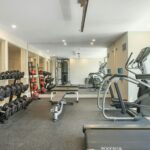 Best home gym flooring options including rubber, hardwood, foam, and epoxy