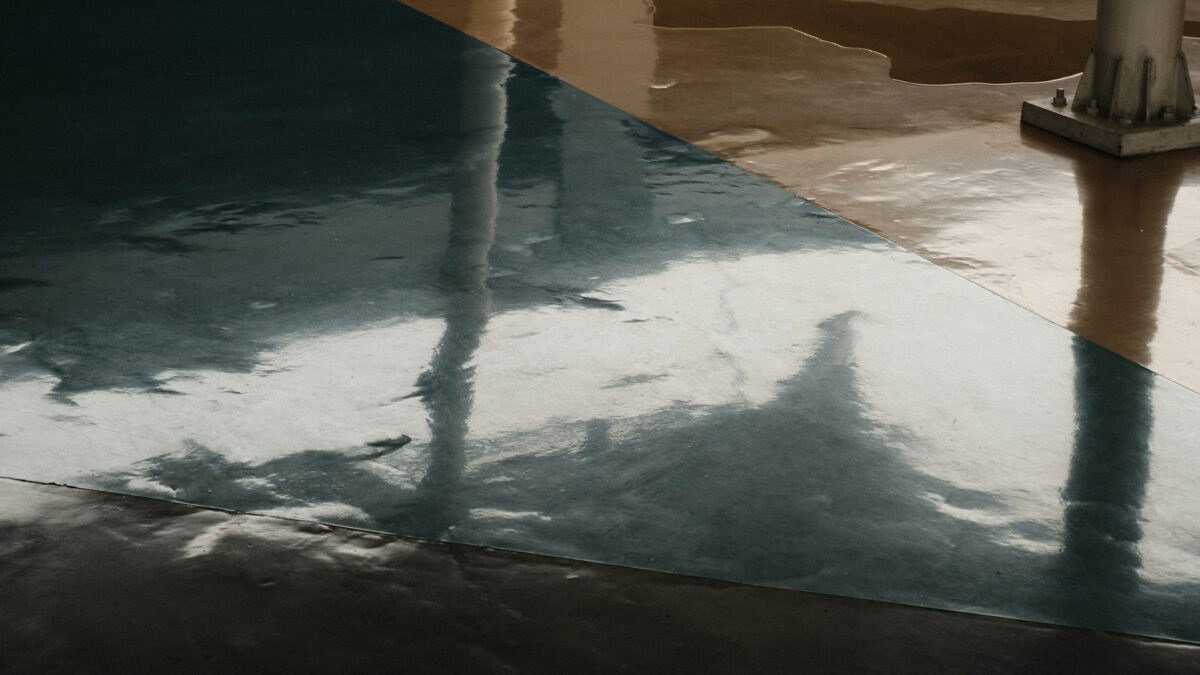Cracked epoxy floor showing surface damage and coating failure